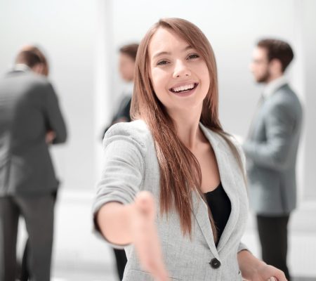 successful businesswoman holding out her hand for a handshake.concept of partnership